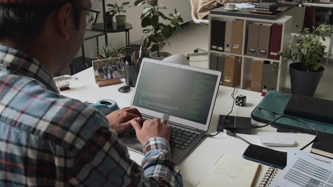 male software engineer coding on laptop in office 3052431 high 0011